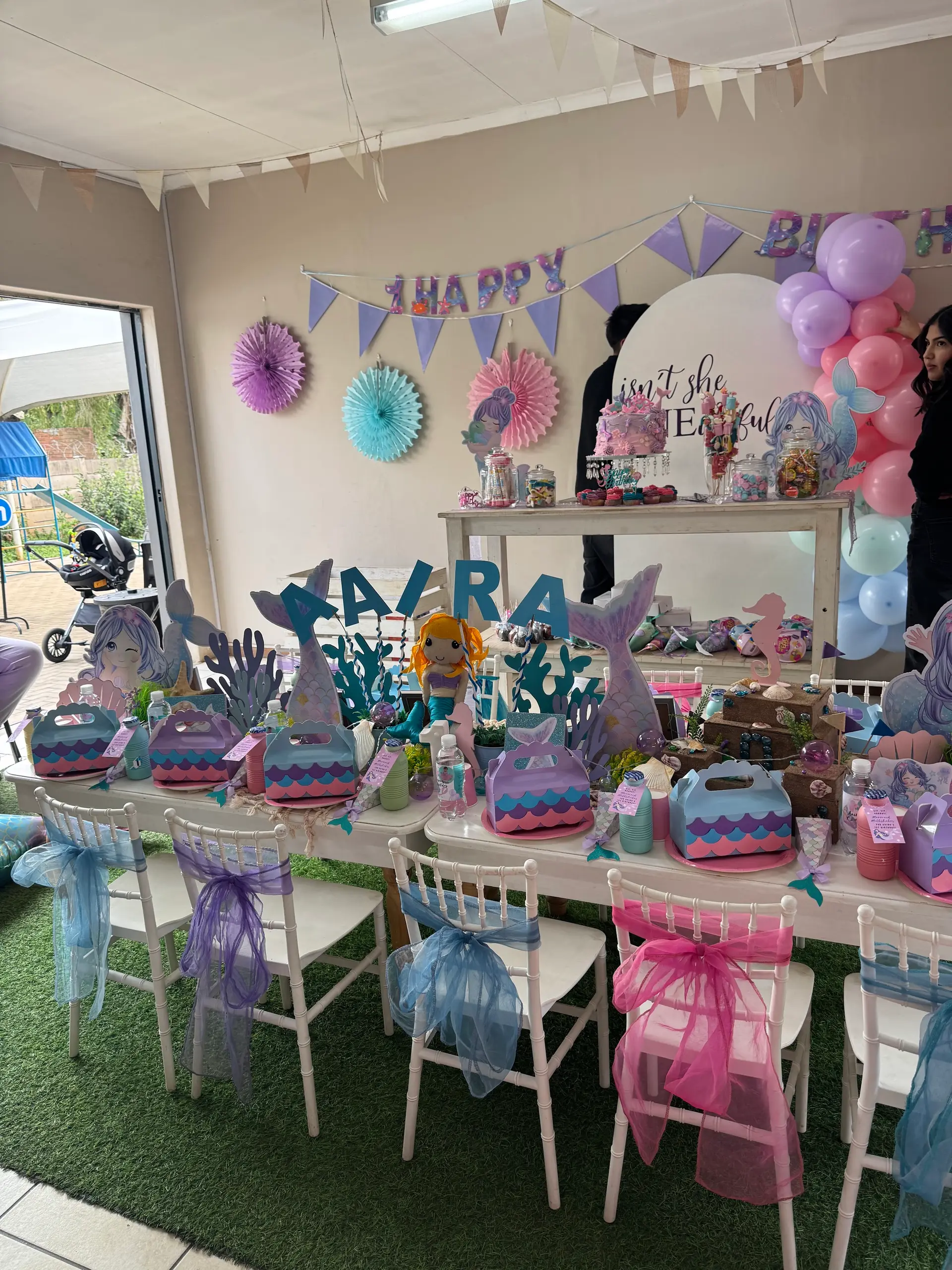 Party tables set under the covered patio
